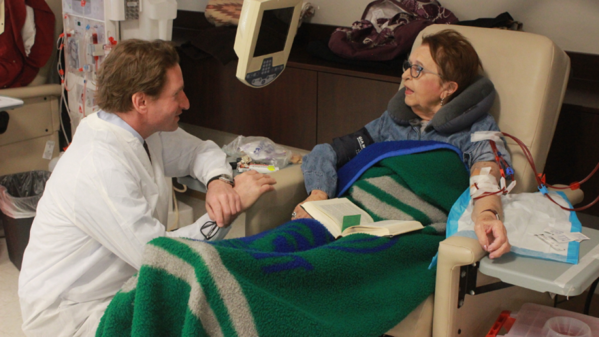 Phillips talks with patient